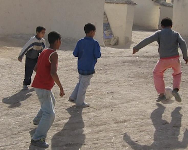 Children playing soccer